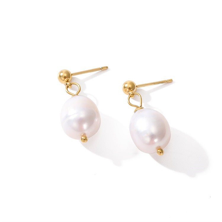 Freshwater pearl drop earrings with gold-filled hardware on white background